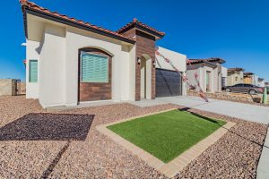 A brand new luxury Santana home is displayed from the front left side in El Paso